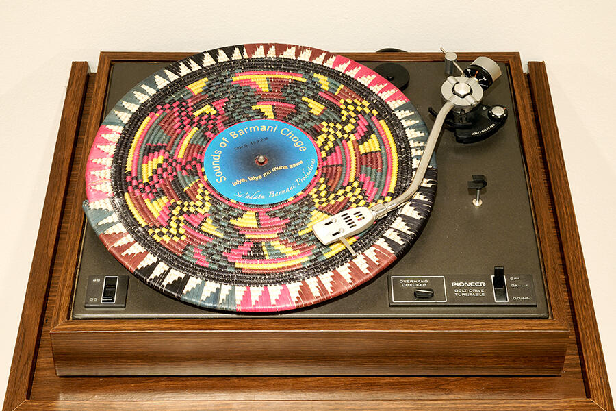 Fatimah Tuggar's artwork: a record player with folk art on the record