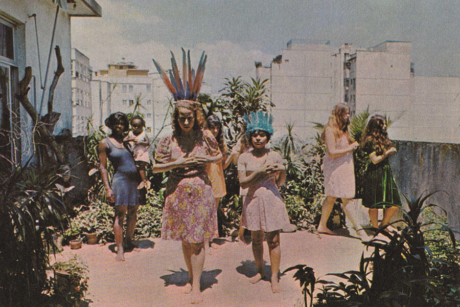 image of girls in feather headdresses