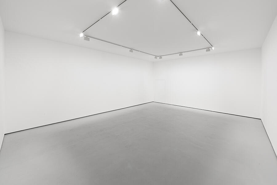 Global Myopia displayed at the 2015 Venice Bienniale: A white room with minimalist overhead lighting