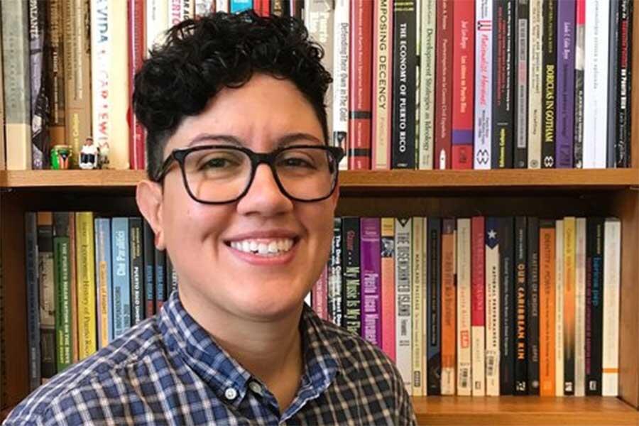 a portrait of a person (Dr. Marisol LeBr&oacute;n) smiling and looking at the camera