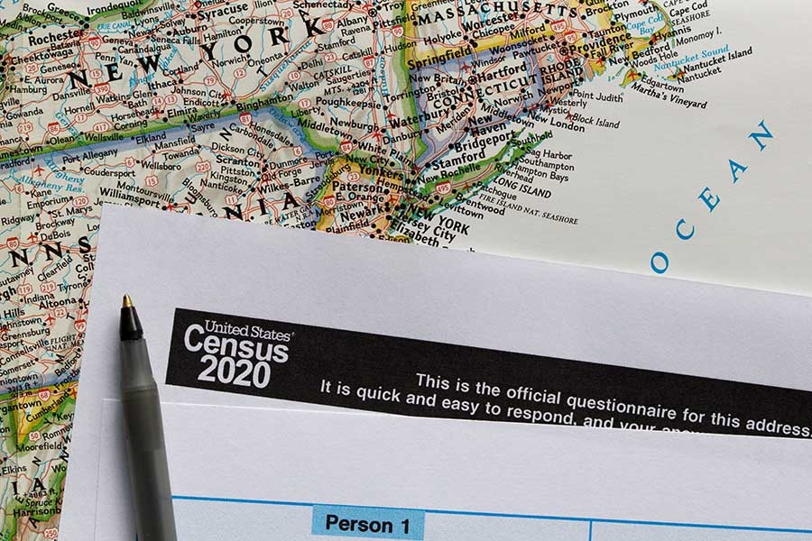 image of a map of the east cost U.S. with a piece of paper on it that says "Census 2020"