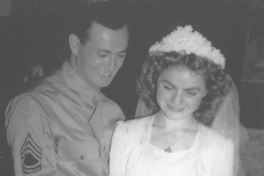 Jewish woman cutting wedding cake