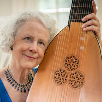 Photo of Catherine Liddell holding a lute