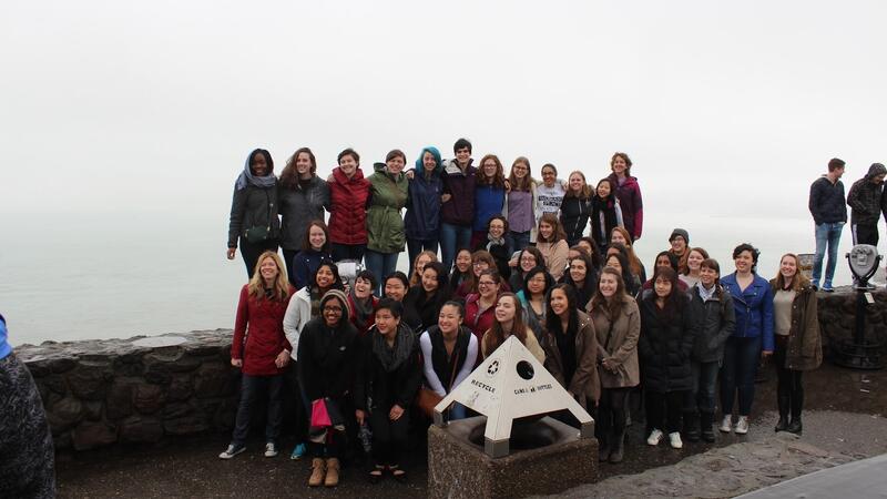 choir group posing near the water