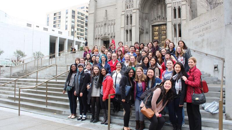 choir posing in front of church