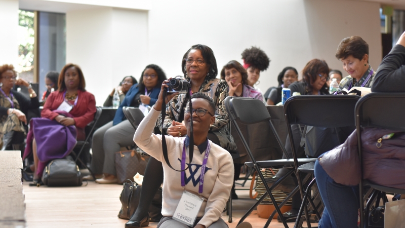 People watching a speaker from the audience