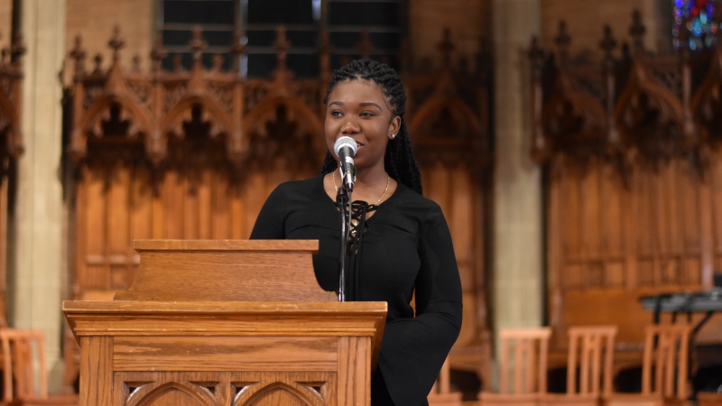 Student speaking at Interfaith Service