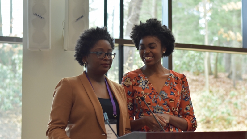 Two people speaking at the podium