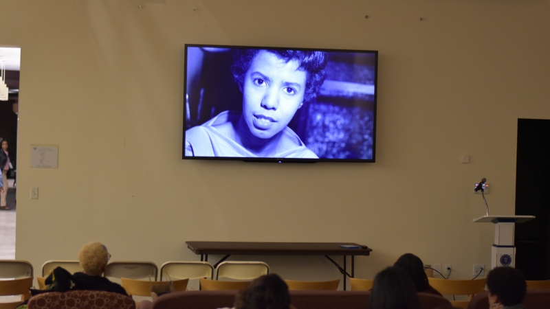  A TV screen mounted on the wall for the Ethos screening