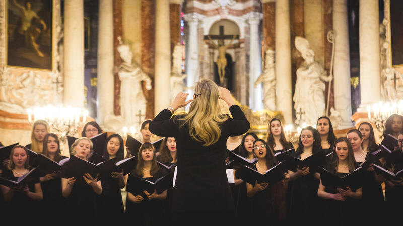 choir performing in church in front of director