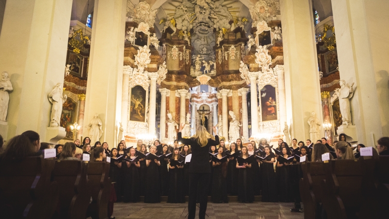 wide shot of choir performing in elegant church