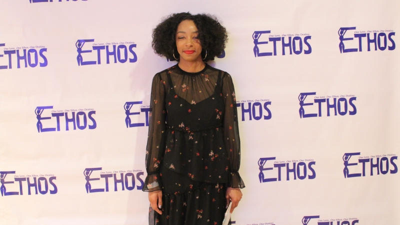 Student standing in a dress for the Ethos gala