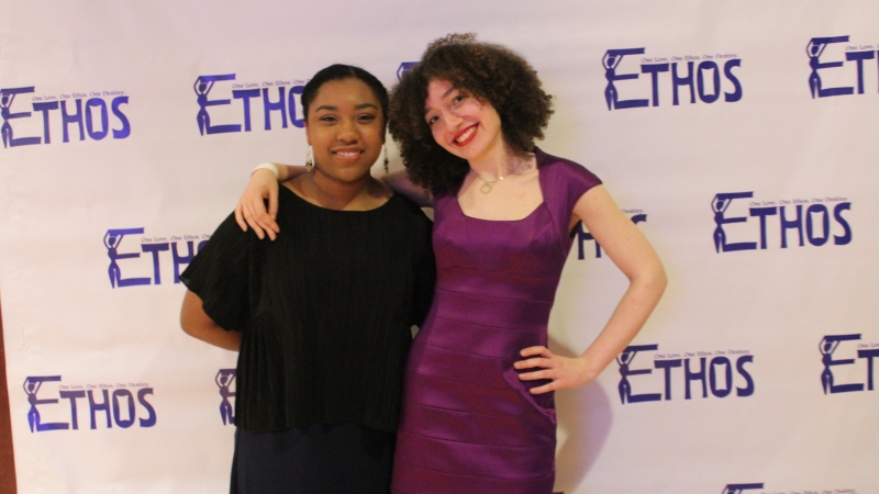 Two students standing in dresses for the Ethos gala