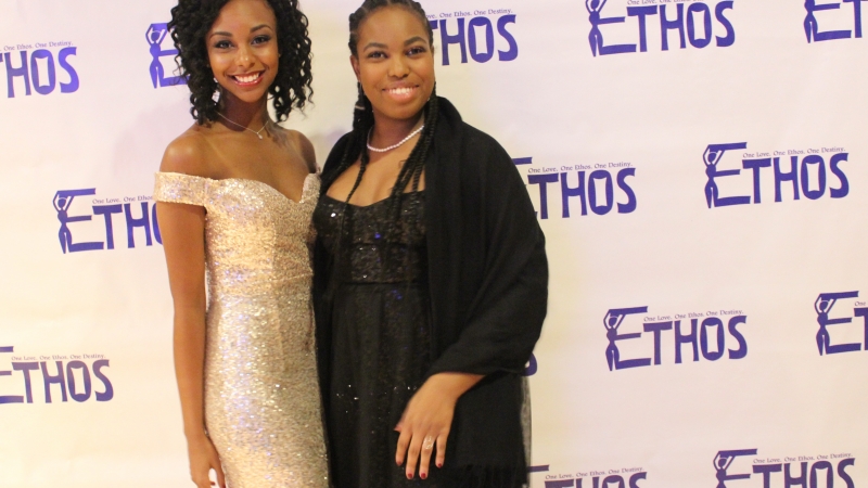 Two students standing in dresses for the Ethos gala