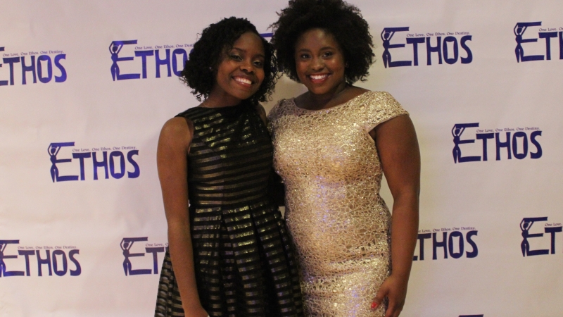 Two students standing in dresses for the Ethos gala