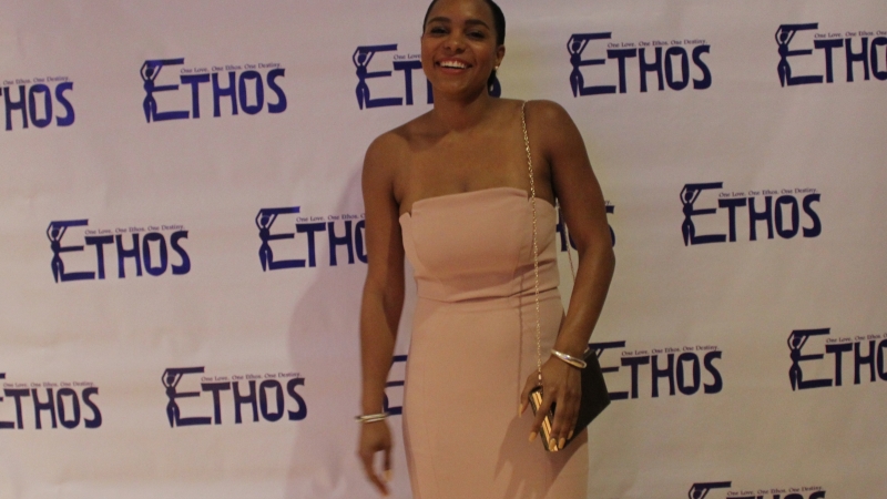 A student standing in a dress for the Ethos gala