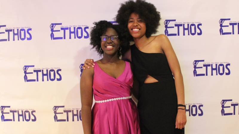 Two students standing in dresses for the Ethos gala