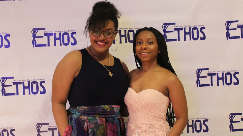 Two students standing in dresses for the Ethos gala