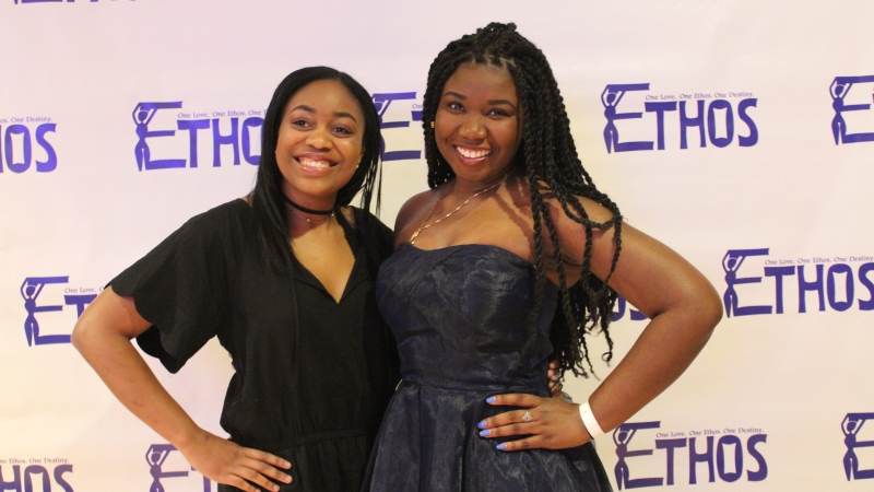 Two students standing in dresses for the Ethos gala