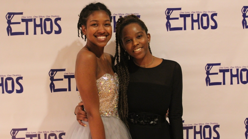 Two students standing in dresses for the Ethos gala