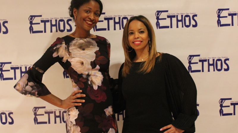 Two students standing in dresses for the Ethos gala