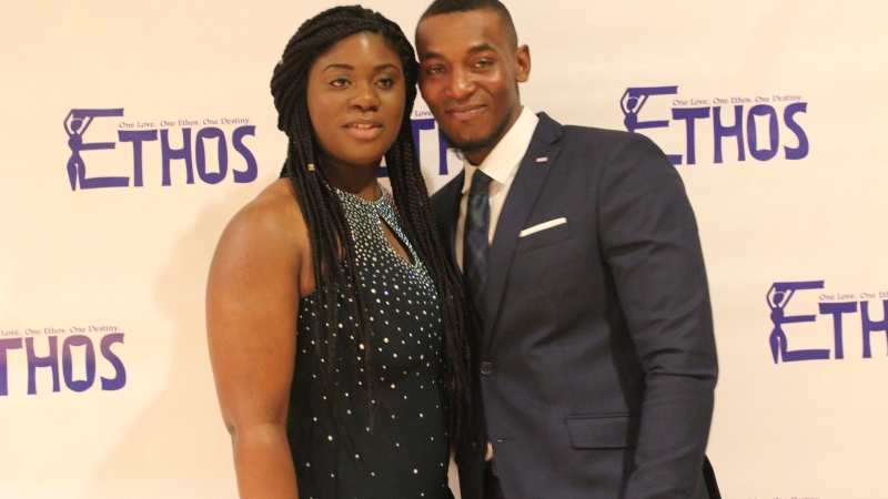 A man and a women standing in fancy dress for the Ethos gala