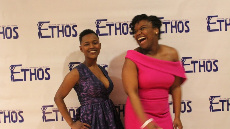 Two students standing in dresses for the Ethos gala