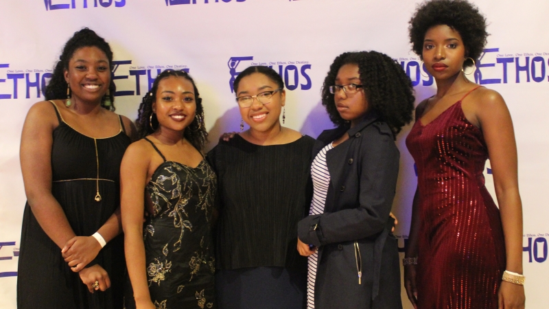 Five students standing in dresses for the Ethos gala