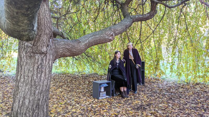 Actors playing Queen and King outdoors filming on Wellesley campus