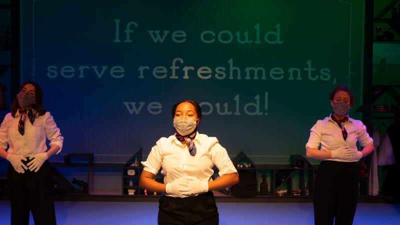 3 actors in flight attendant suits