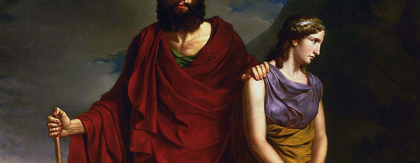 image of a woman guiding a man through a landscape. The man has a walking stick and his eyes are shut.