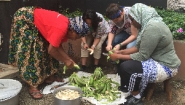 women peeling fruit in Tanzania