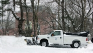 grounds crew plowing snow