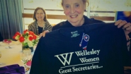 Madeleine Albright '59 holds a Wellesley t-shirt