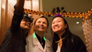 President Bottomly takes a "selfie" with trick or treating students