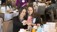 Leilani Stacy ‘18, a finalist in a national essay contest, snaps a picture with her mother at a gathering hosted by the contest’s sponsoring organization, Womenetics.