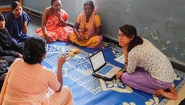 Wellesley College Student Jessica Saifee talks with a group of women in rural India