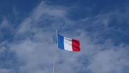 The French flag against a blue sky