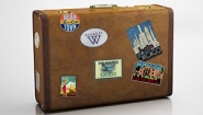 Old leather suitcase with destination stickers