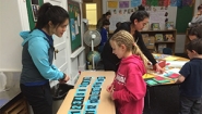 Elizabeth Hau ‘16, left, and a student at John D. Hardy Elementary School