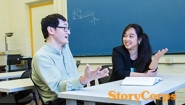 StoryCorps interview subjects Xi Xi ’17 and Professor Stanley Chang converse in a Wellesley classroom