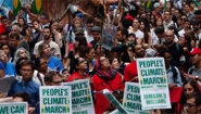 crowd with banners at NYC climate march
