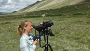 Kessler looks through spotting scope