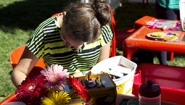 student prepares decorations for Sukkot