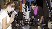 two students work in Welleslsey physics lab