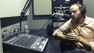 Adam Van Arsdale talks on radio set
