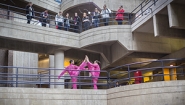 dancers in pink on science center walkway