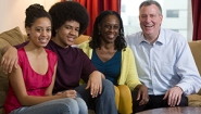 McCray posed with de Blasio and their two teenage children