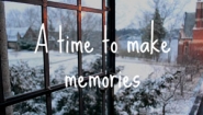 screenshot from Wellesley holiday video showing open window with snowy view and the words, "A time to make memories"