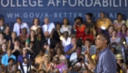 Obama on campaign trail with "College Affordability" sign behind him